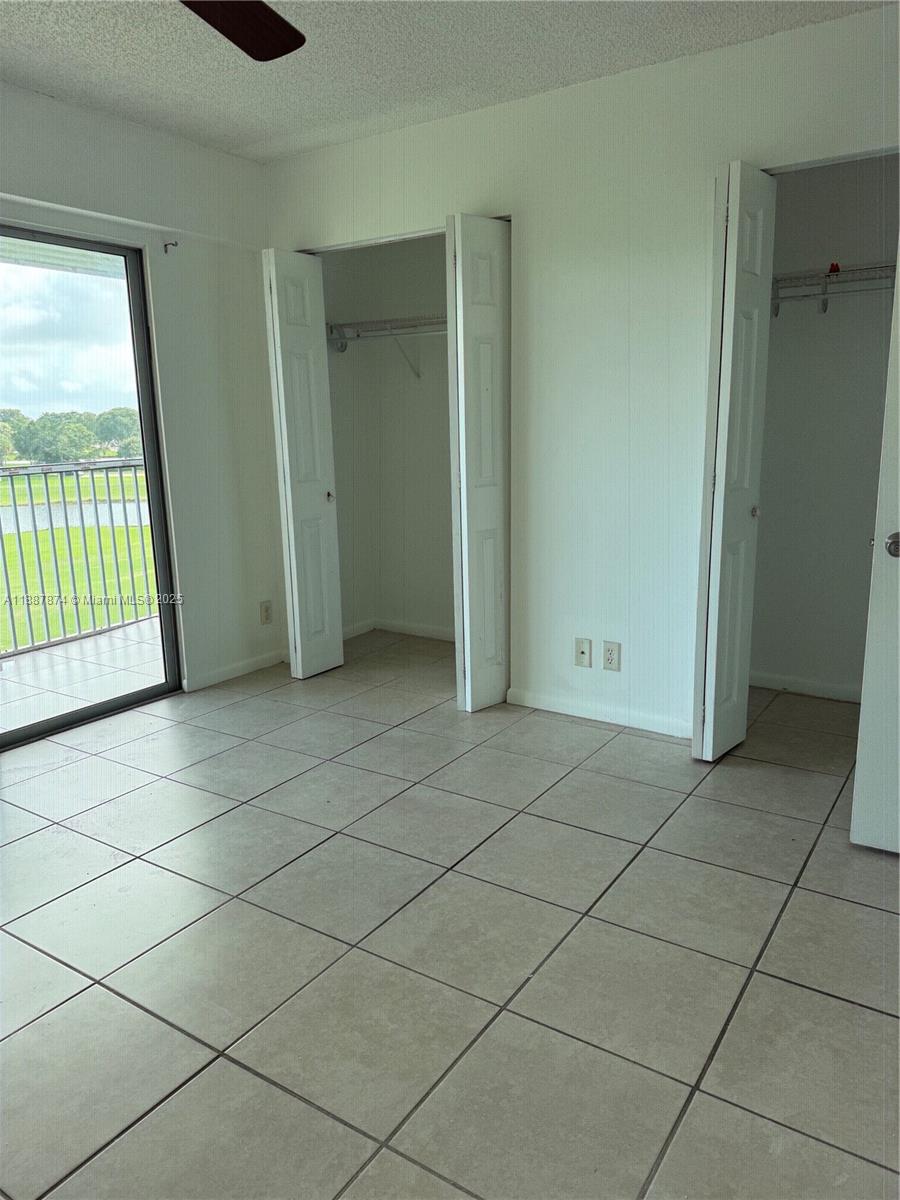 13550 Southwest 6th Court, Unit 409A Pembroke Pines, FL 33027 - Photo 9 of 20 an empty room with windows