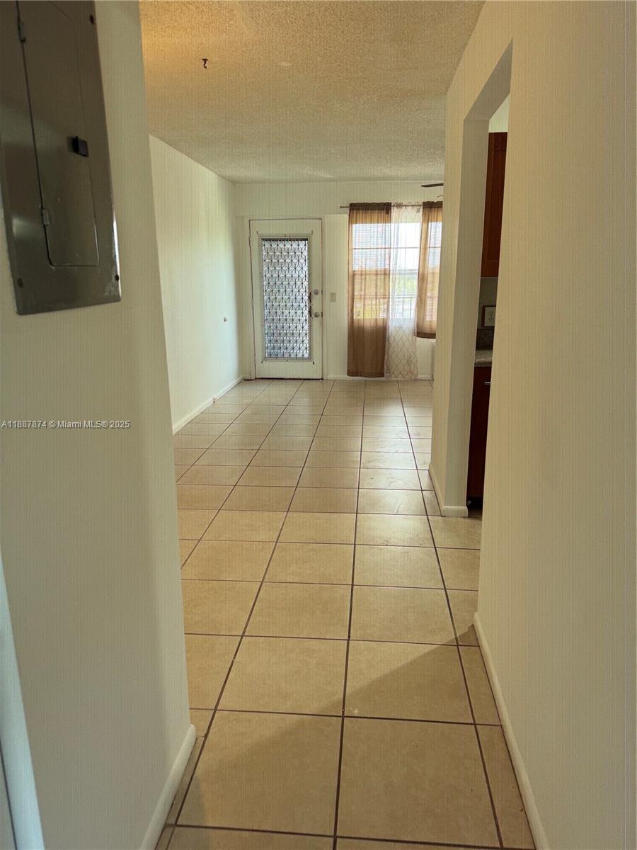 13550 Southwest 6th Court, Unit 409A Pembroke Pines, FL 33027 - Photo 10 of 20 a view of an empty room and window