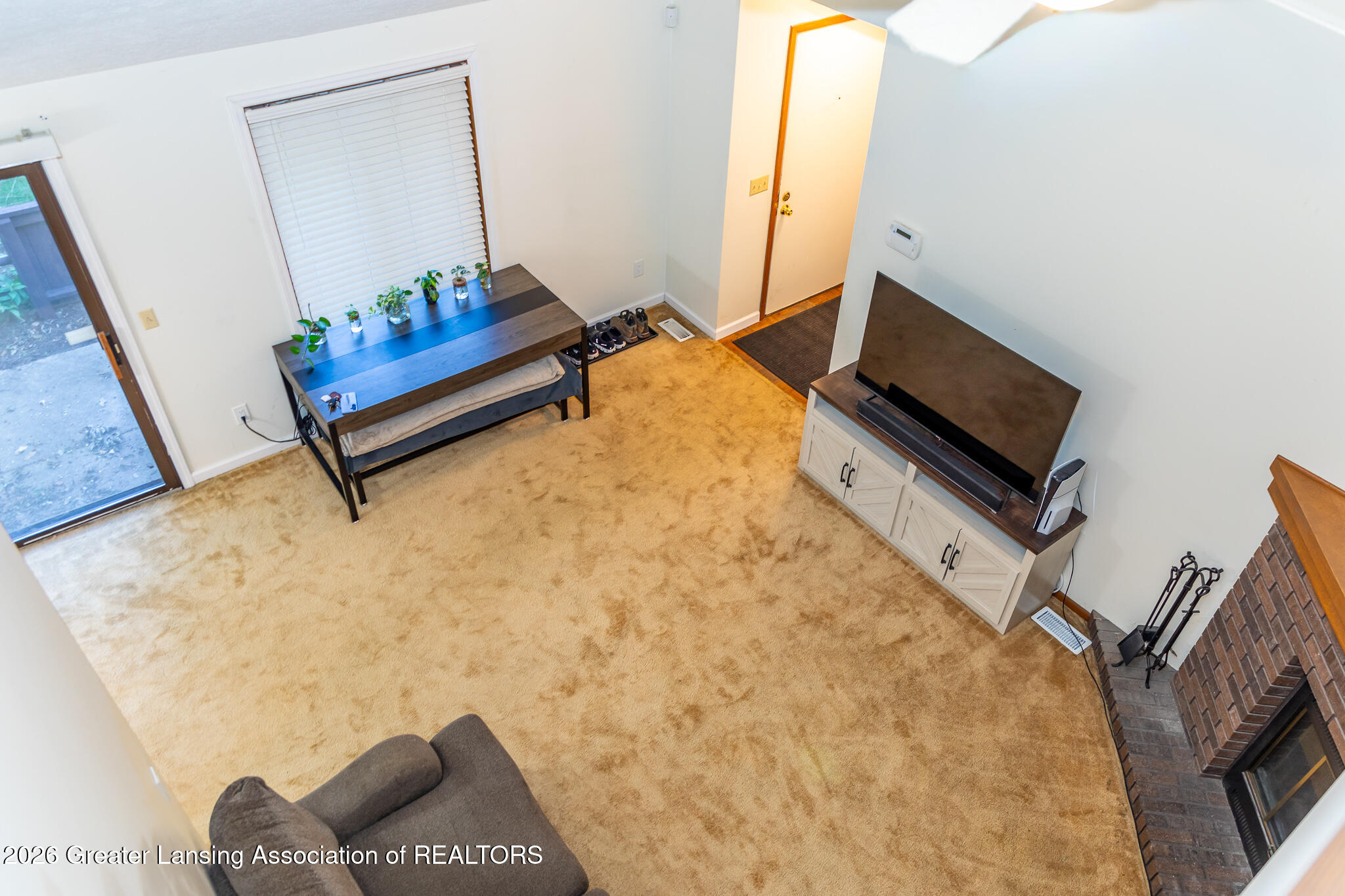 101 East Jolly Road, Unit B8 24 Lansing, MI 48910 - Photo 28 of 43 View of living room from loft