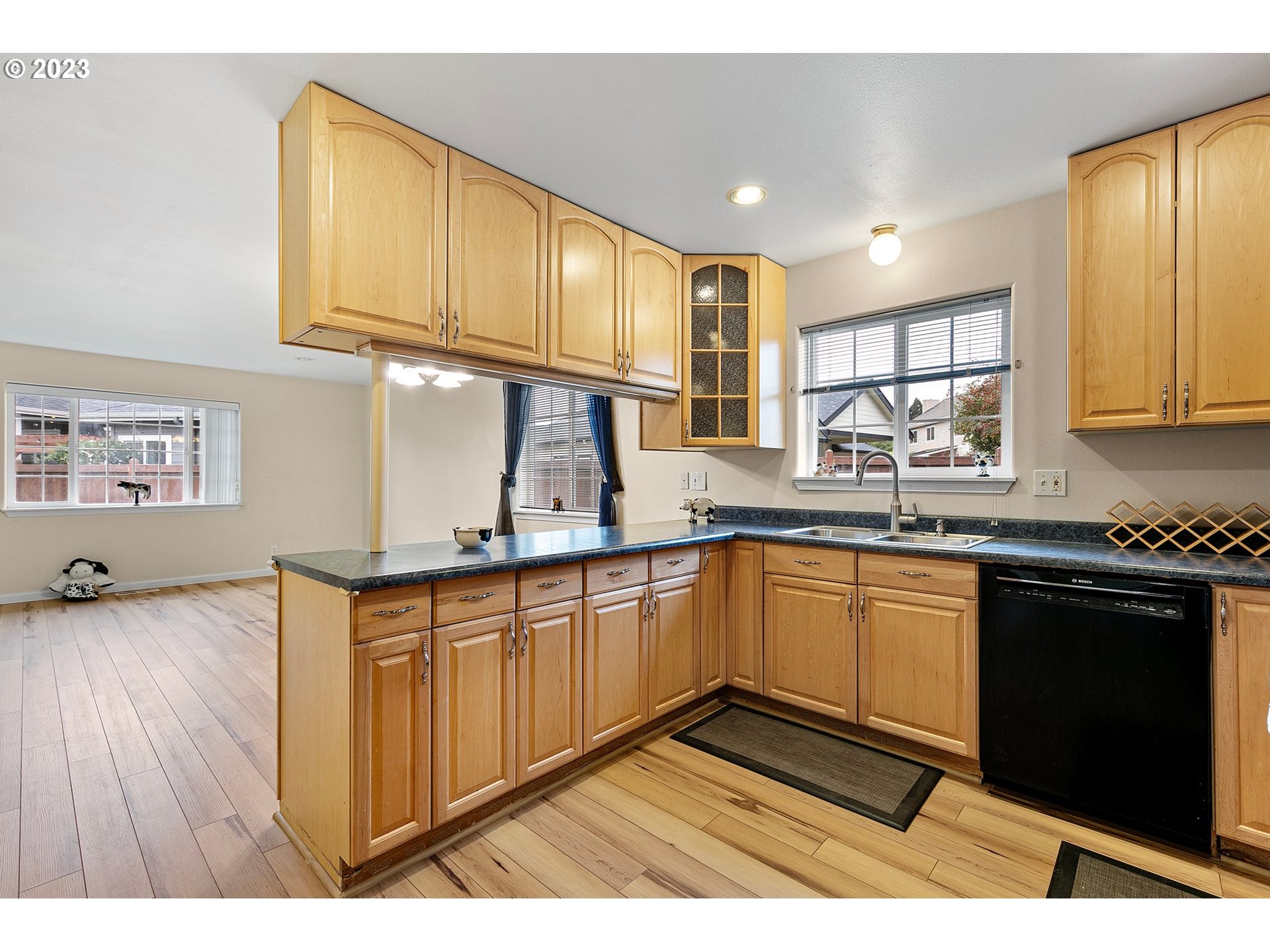1038 Diamond Street Springfield, OR 97477 - Photo 11 of 48 a kitchen with stainless steel appliances granite countertop a sink stove and cabinets