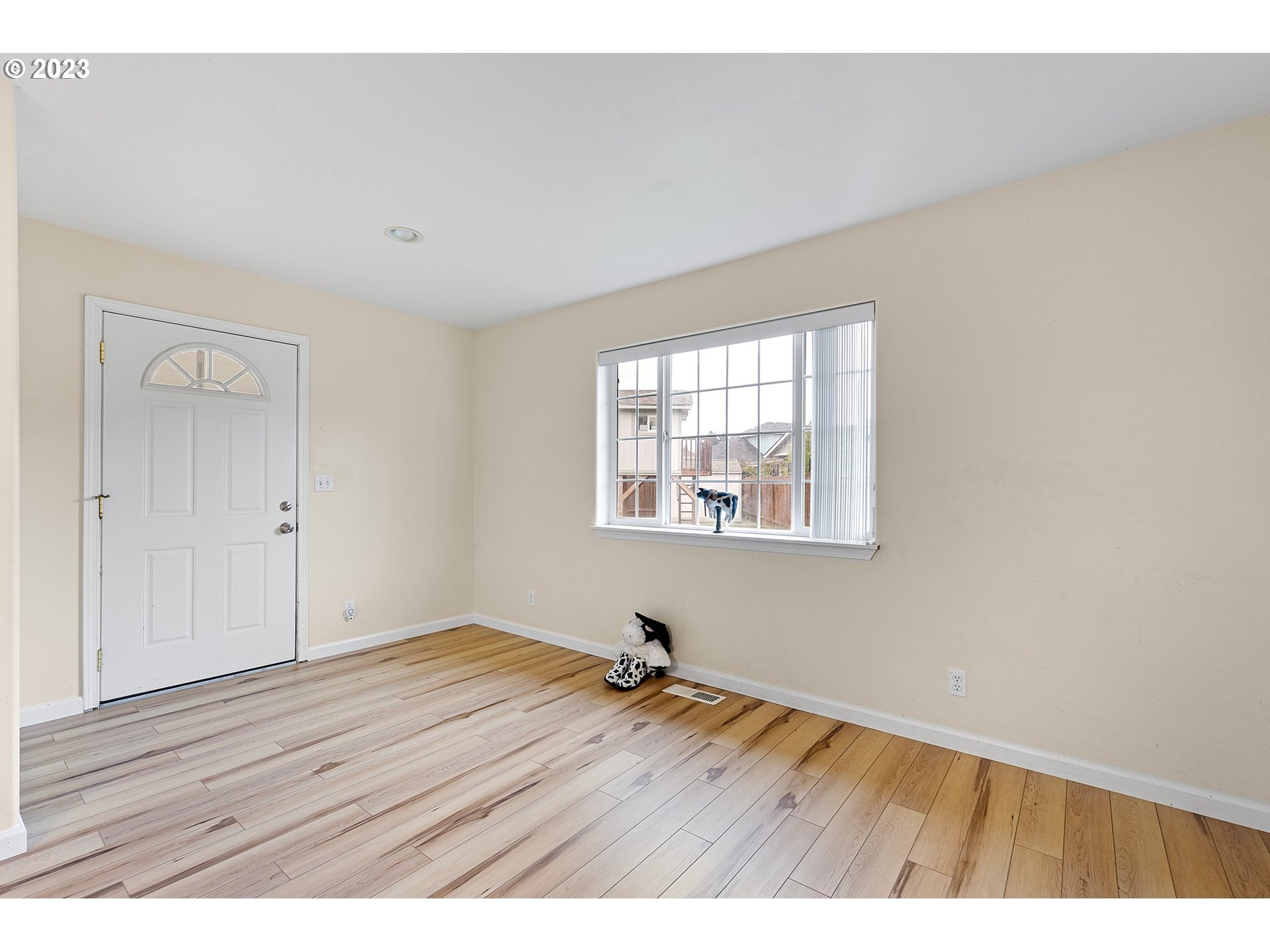 1038 Diamond Street Springfield, OR 97477 - Photo 16 of 48 a view of an empty room with wooden floor and a window