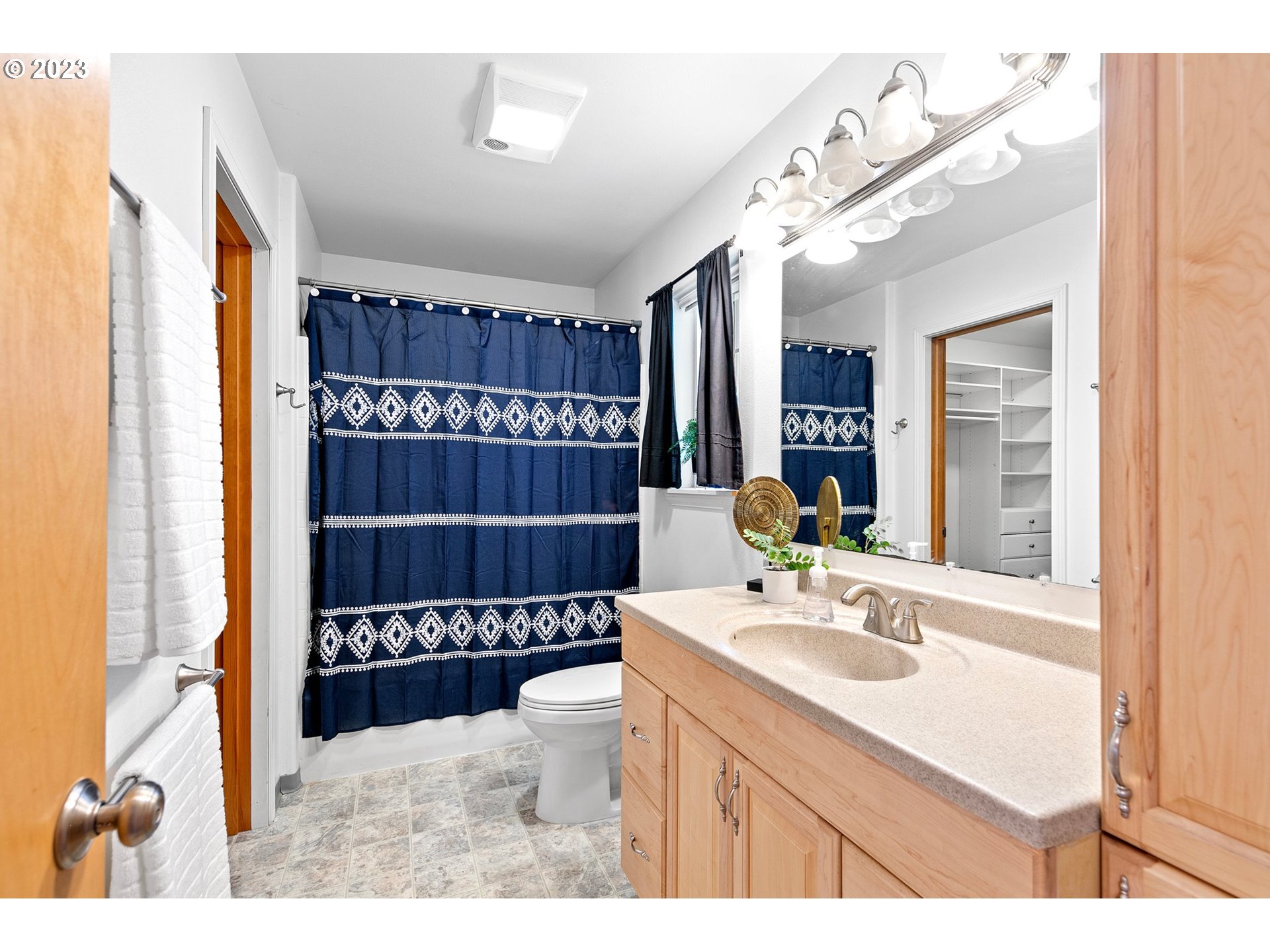 1038 Diamond Street Springfield, OR 97477 - Photo 24 of 48 a bathroom with a sink a mirror and shower