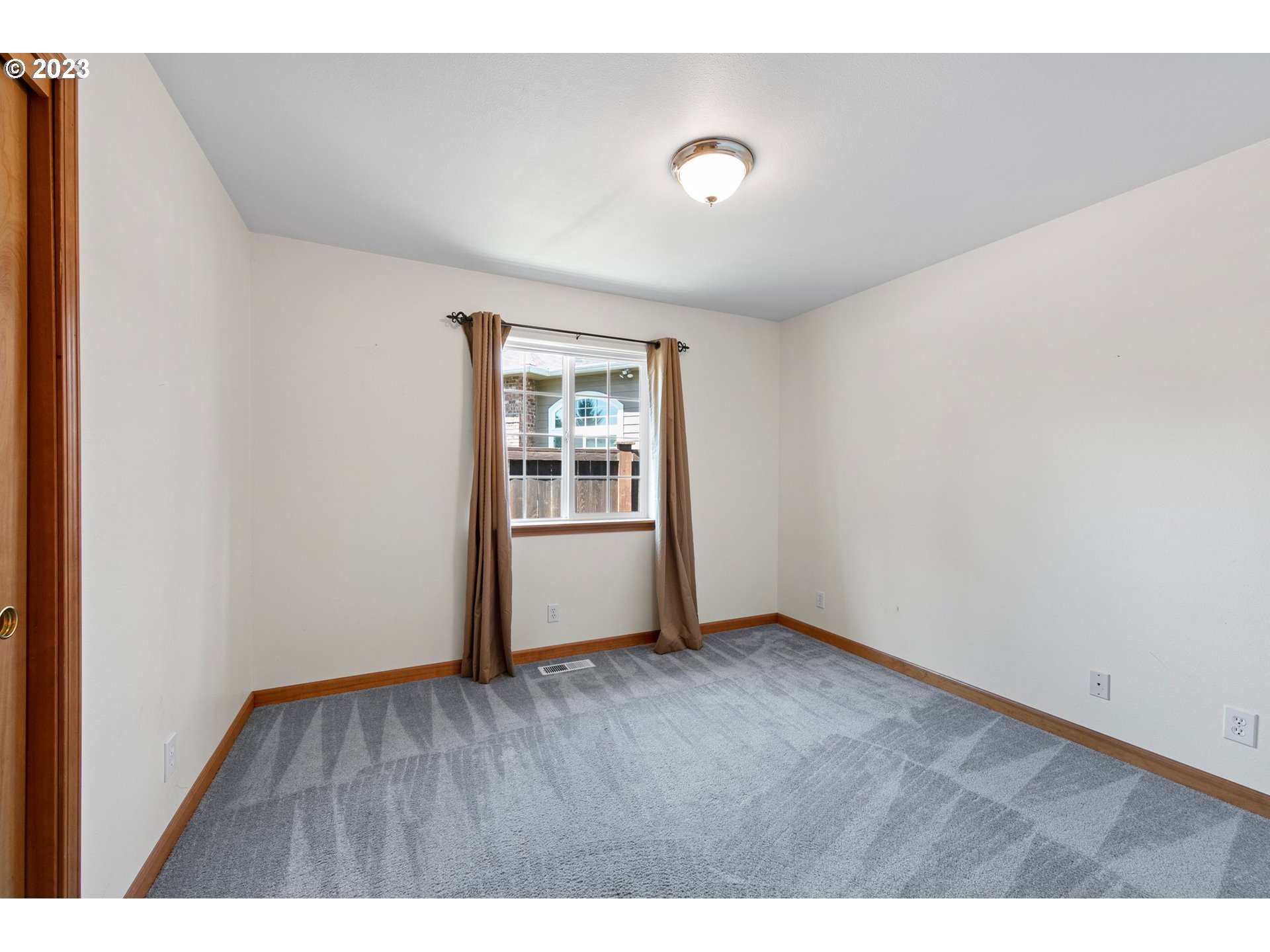 1038 Diamond Street Springfield, OR 97477 - Photo 30 of 48 a view of an empty room with wooden floor and a window