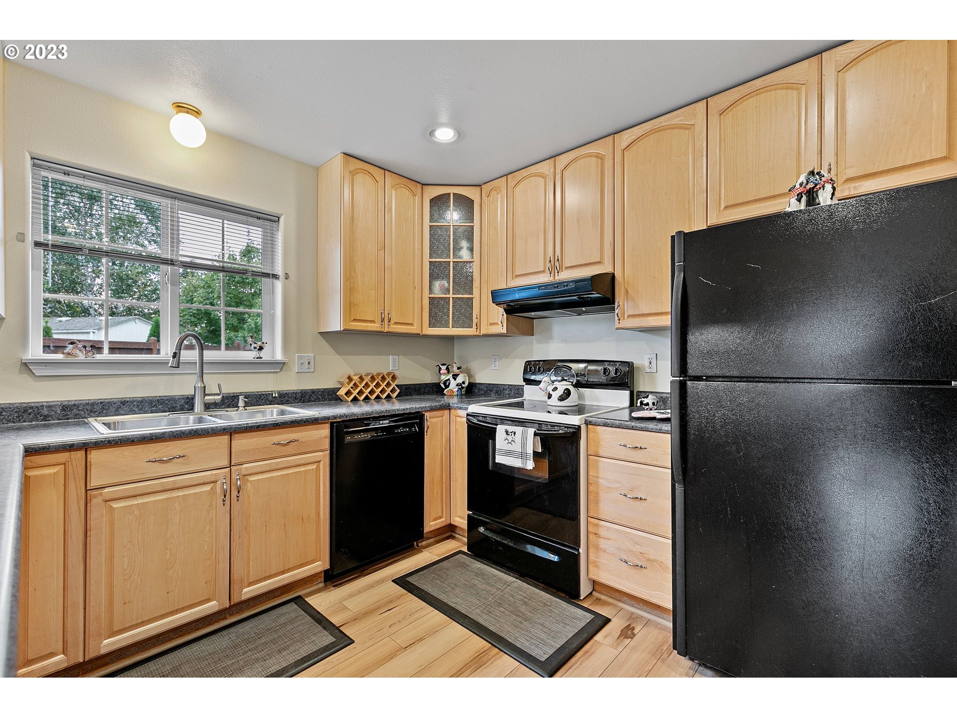 1038 Diamond Street Springfield, OR 97477 - Photo 9 of 48 a kitchen with granite countertop a refrigerator stove top oven and sink