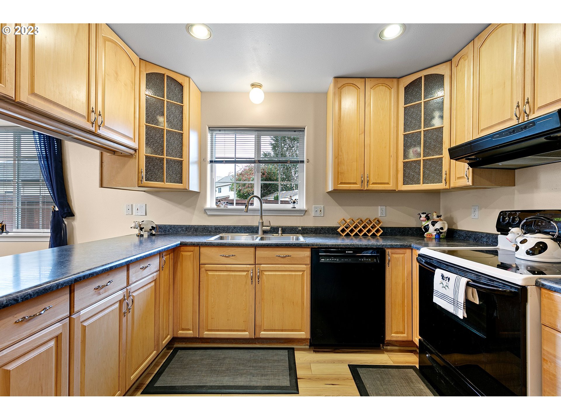 1038 Diamond Street Springfield, OR 97477 - Photo 10 of 48 a kitchen with stainless steel appliances granite countertop a stove a sink and a microwave