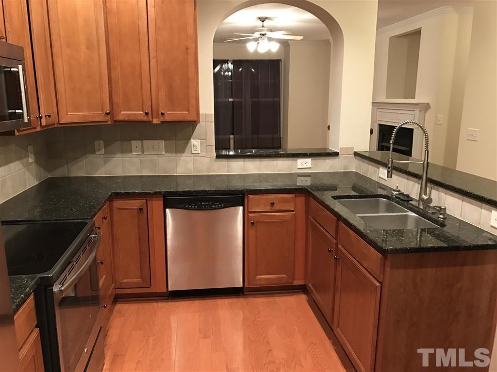 5010 Celtic Court Raleigh, NC 27612 - Photo 12 of 20 a kitchen with a sink and cabinets
