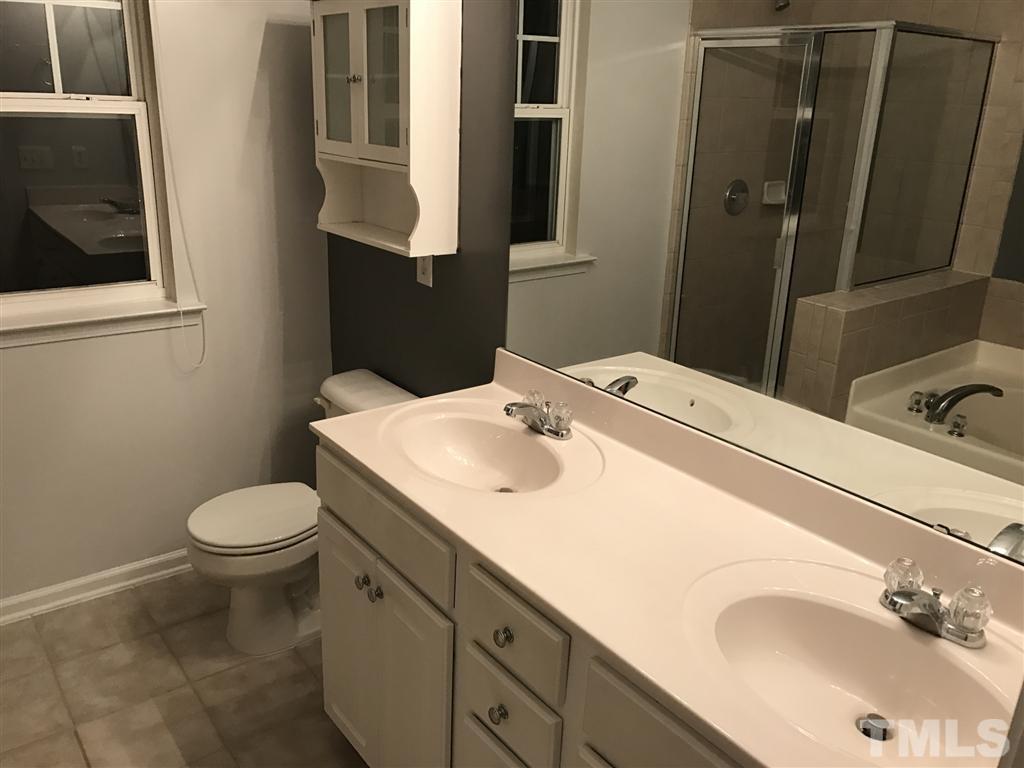 5010 Celtic Court Raleigh, NC 27612 - Photo 19 of 20 a bathroom with a sink toilet and mirror