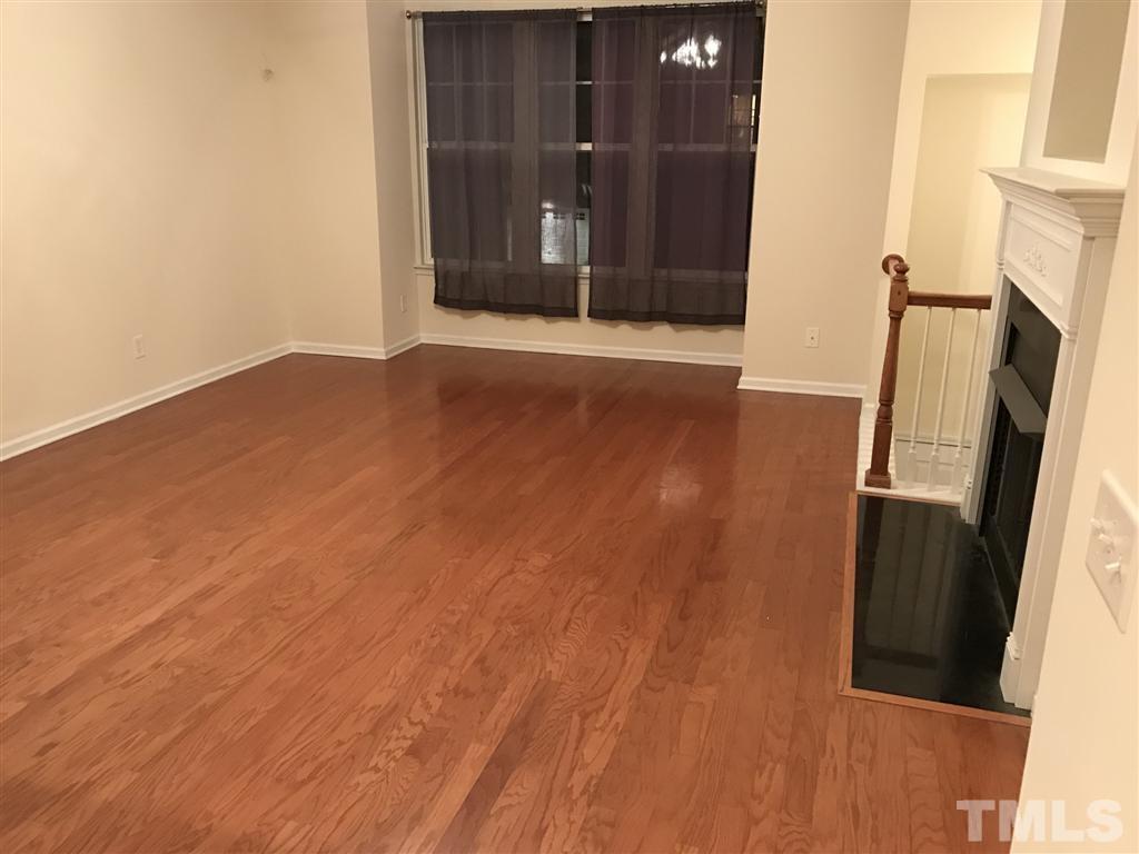 5010 Celtic Court Raleigh, NC 27612 - Photo 10 of 20 an empty room with wooden floor and entrance