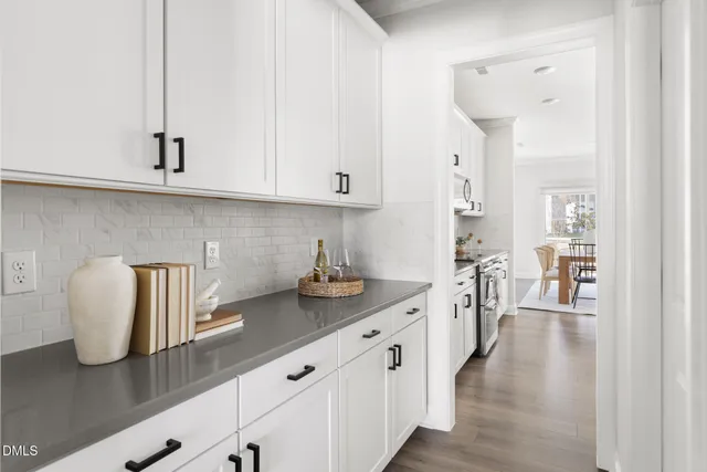 a kitchen with sink and cabinets
