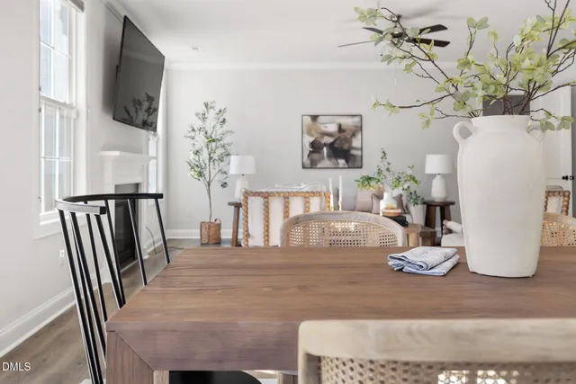 a dining room with furniture and wooden floor