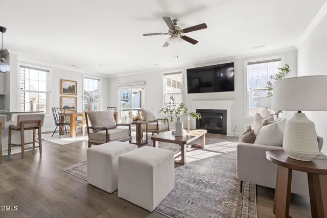 a living room with furniture fireplace and a flat screen tv