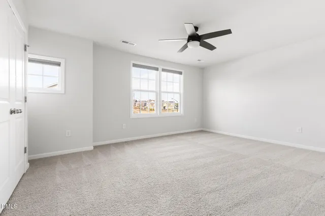 a balcony with furniture and a view of city from the porch