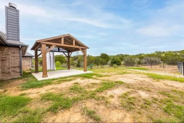 a view of a lake with a big yard