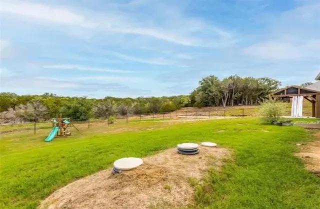 a view of a lake with a big yard