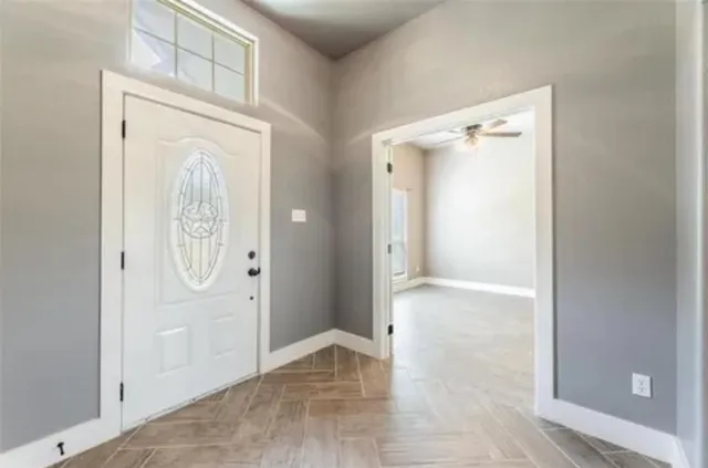 wooden floor with white walls