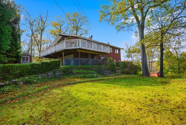 a view of a house with a yard
