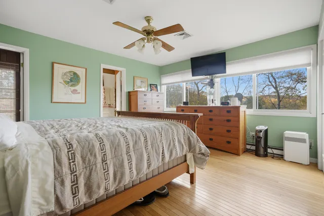 a bed room with a bed and a tv