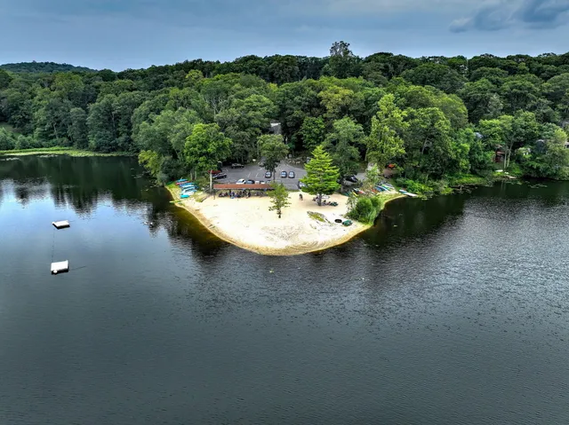 an aerial view of a house with a yard and a garden