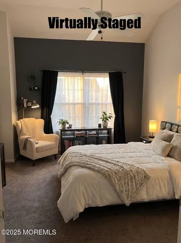 a bedroom with bed and window