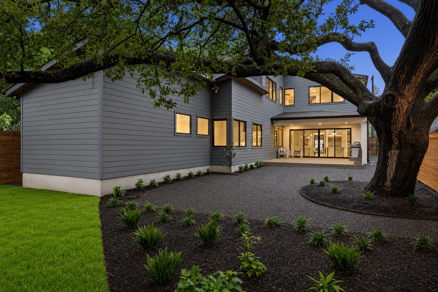 5405 Montview Street Austin, TX 78756 - Photo 2 of 40 A well-manicured, mature Heritage Oak anchors the backyard, creating a canopy of shade and a tranquil setting.
