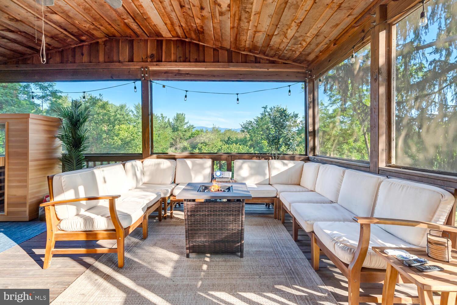 6235 South Page Valley Road Luray, VA 22835 - Photo 30 of 52 Serene screened porch with lush views.