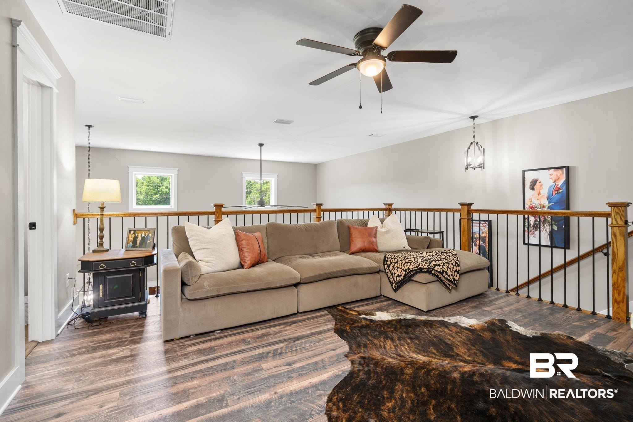 11025 Creax Road Axis, AL 36505 - Photo 28 of 45 Spacious loft area featuring wood-finish flooring, a ceiling fan, and painted walls