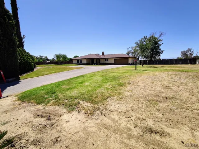 a view of a swimming pool and an outdoor space