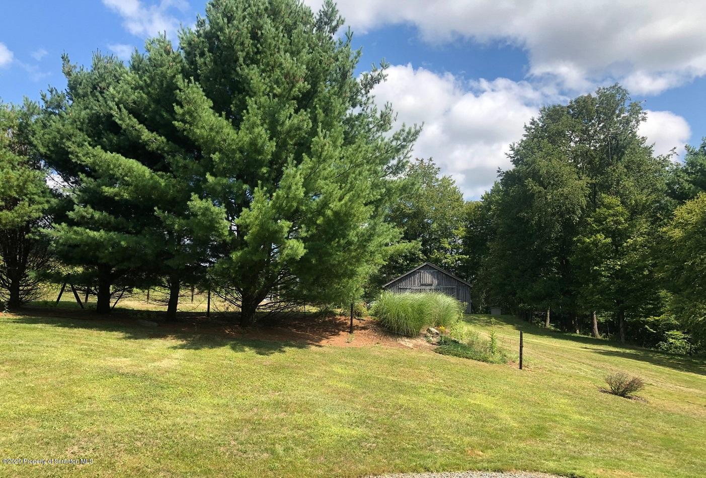 164 Halstead Road Union Dale, PA 18470 - Photo 17 of 36 a view of swimming pool with an outdoor space and seating area