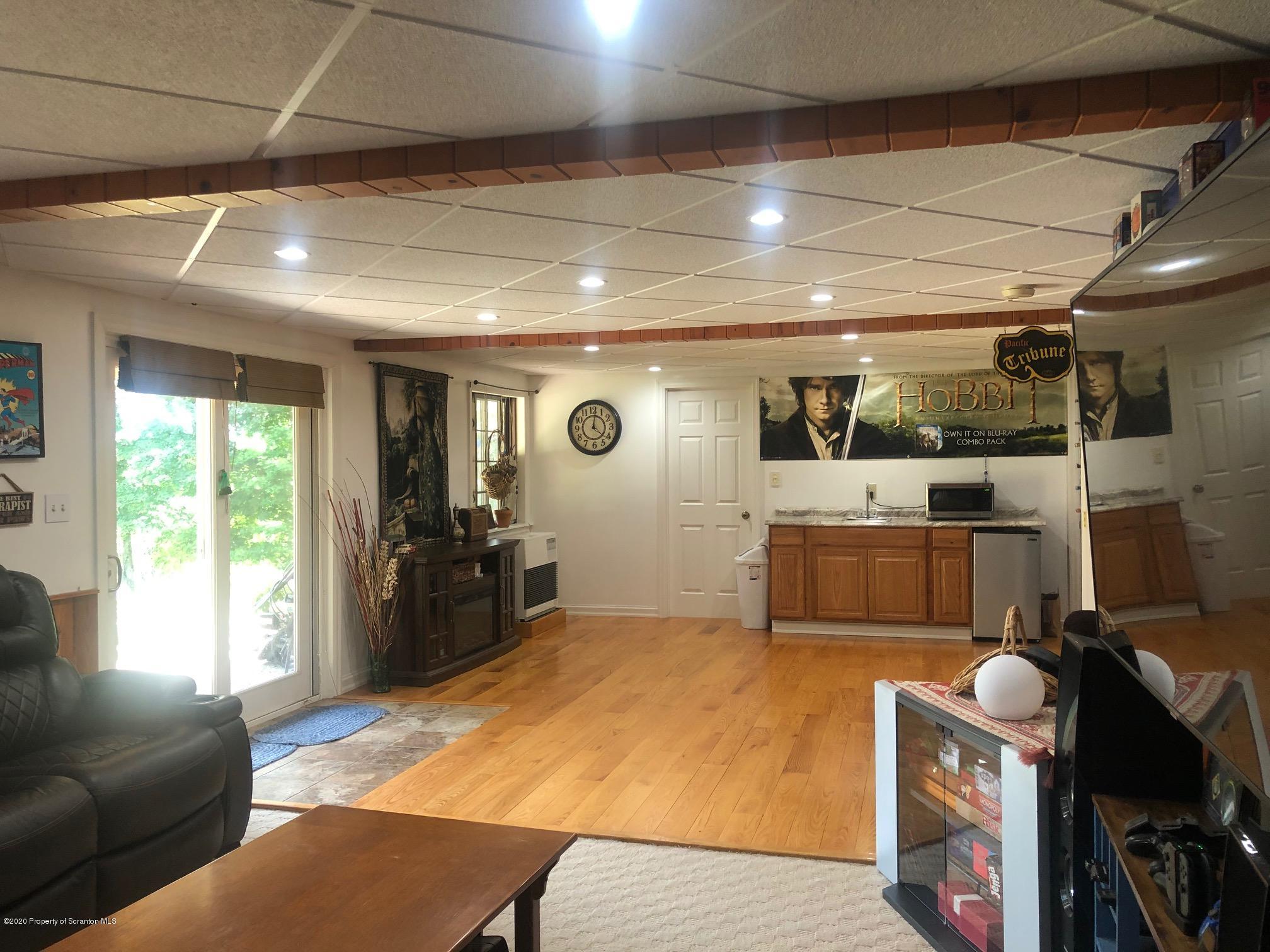 164 Halstead Road Union Dale, PA 18470 - Photo 20 of 36 a room with furniture a flat screen tv and a window