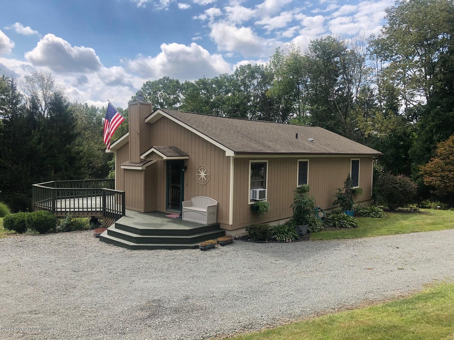 164 Halstead Road Union Dale, PA 18470 - Photo 2 of 36 a house view with a garden space