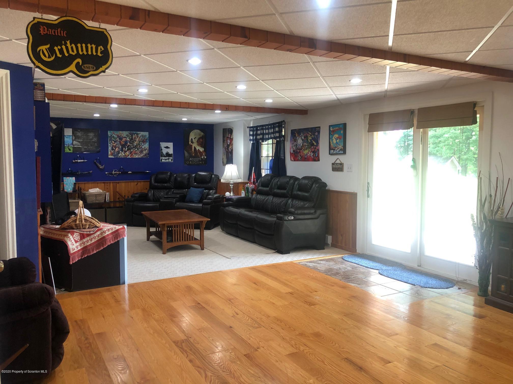 164 Halstead Road Union Dale, PA 18470 - Photo 21 of 36 a living room with furniture and a large window
