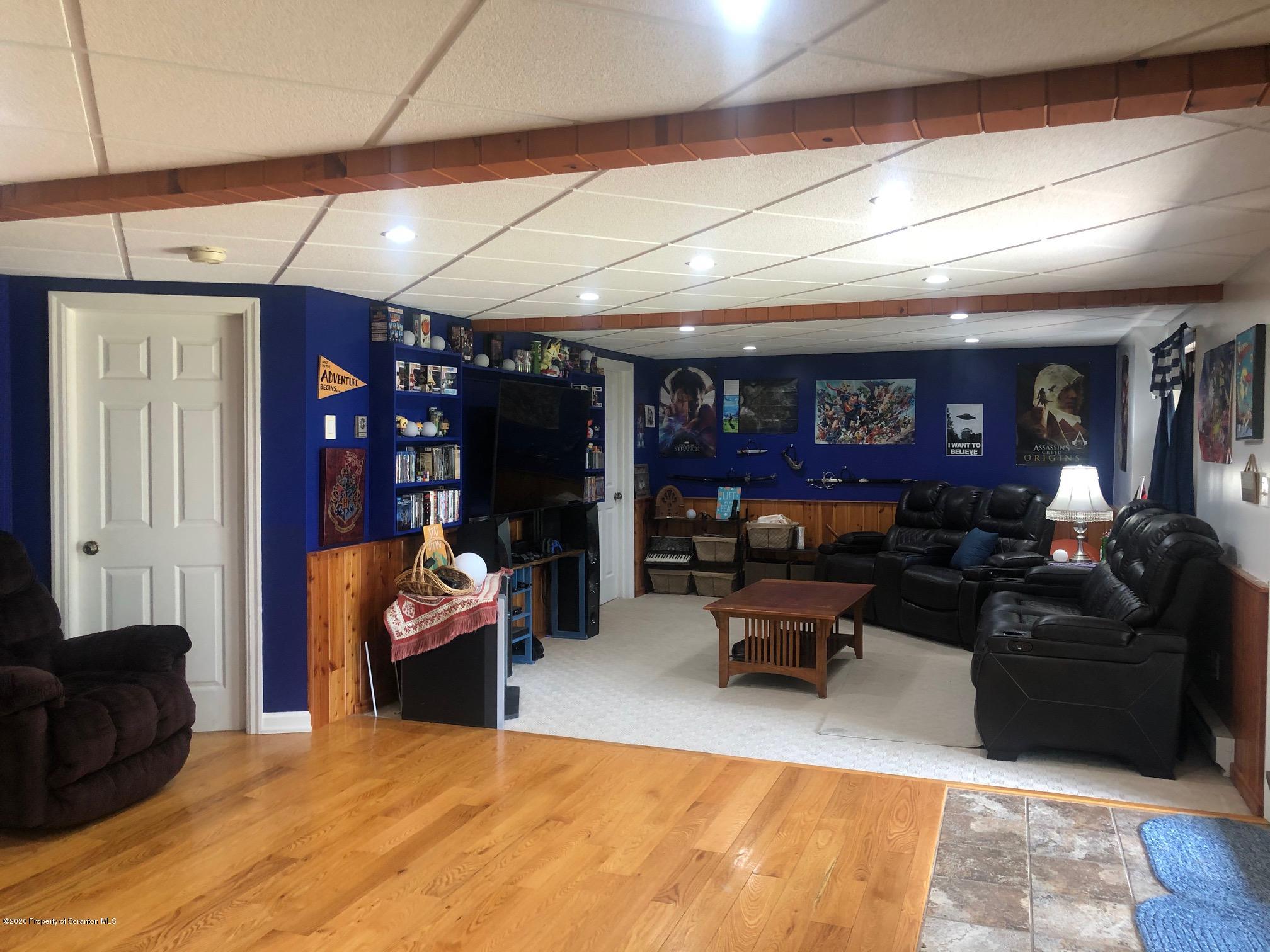 164 Halstead Road Union Dale, PA 18470 - Photo 22 of 36 a living room with furniture a ceiling fan and a rug