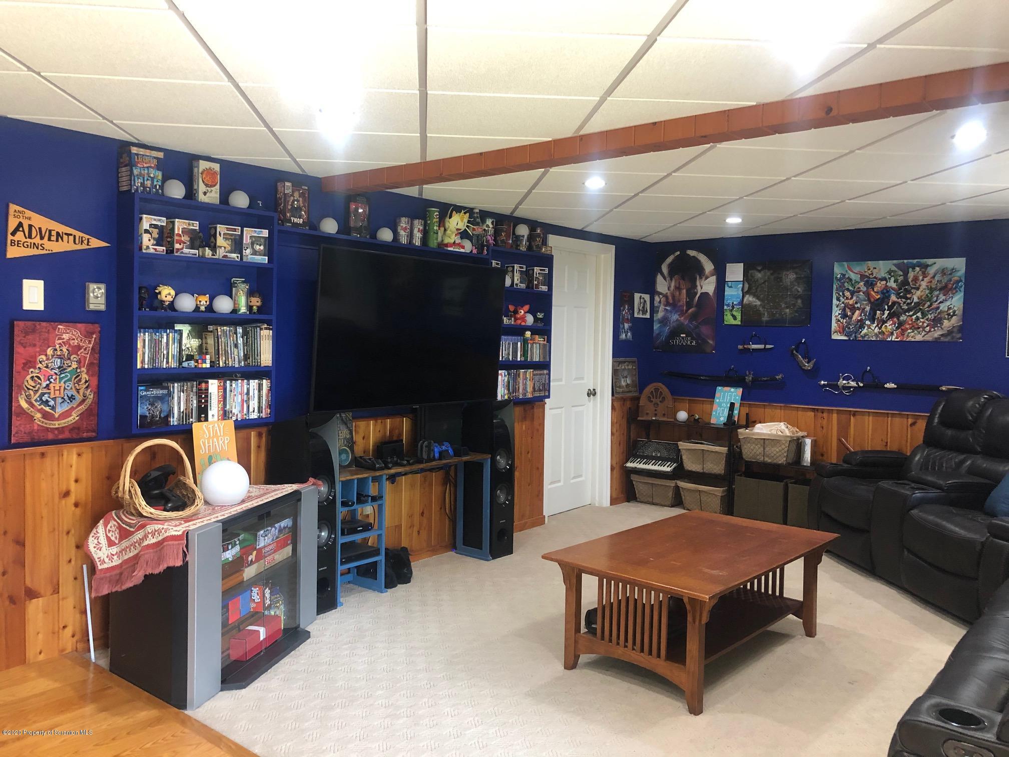 164 Halstead Road Union Dale, PA 18470 - Photo 23 of 36 a living room with furniture and a flat screen tv