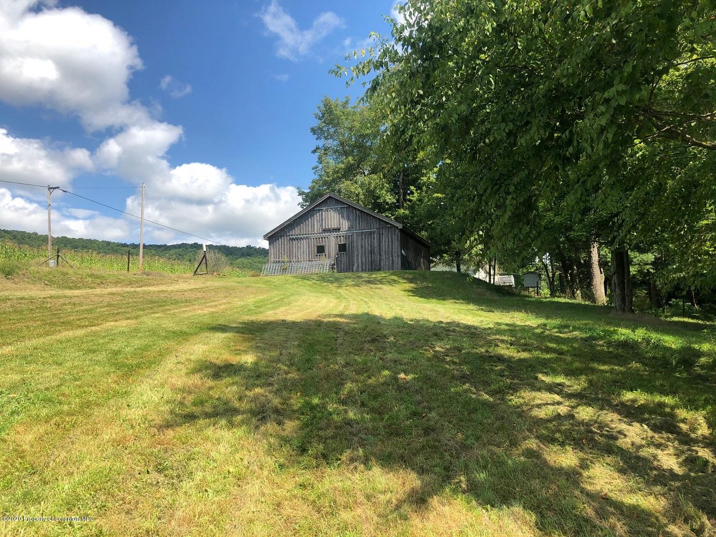 164 Halstead Road Union Dale, PA 18470 - Photo 27 of 36 a view of a house with a swimming pool