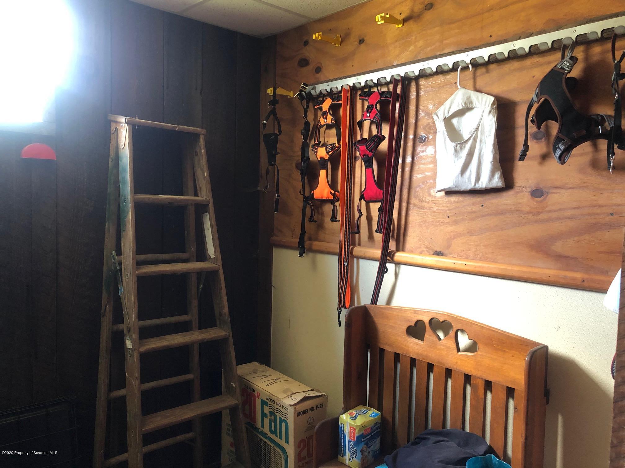 164 Halstead Road Union Dale, PA 18470 - Photo 30 of 36 a view of walk in closet with clothes and shoes