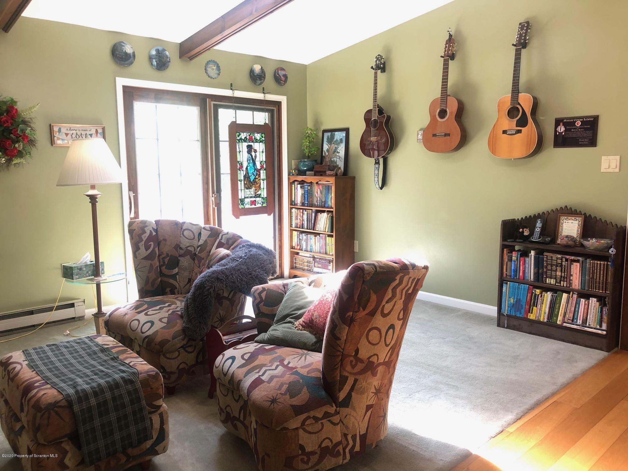 164 Halstead Road Union Dale, PA 18470 - Photo 5 of 36 a living room with furniture and a window