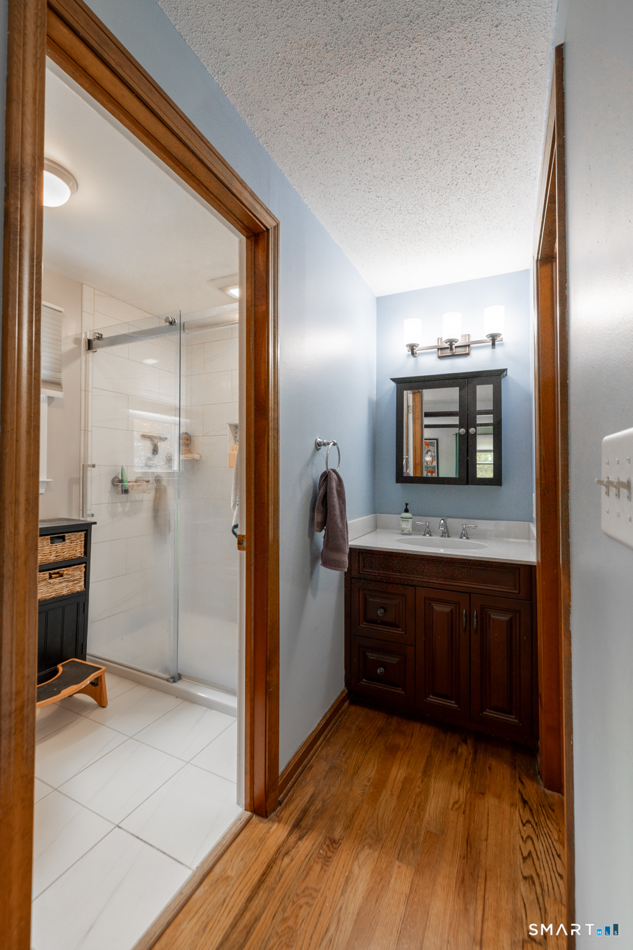 14 Crosswood Road Farmington, CT 06085 - Photo 24 of 39 a bathroom with a sink and a mirror