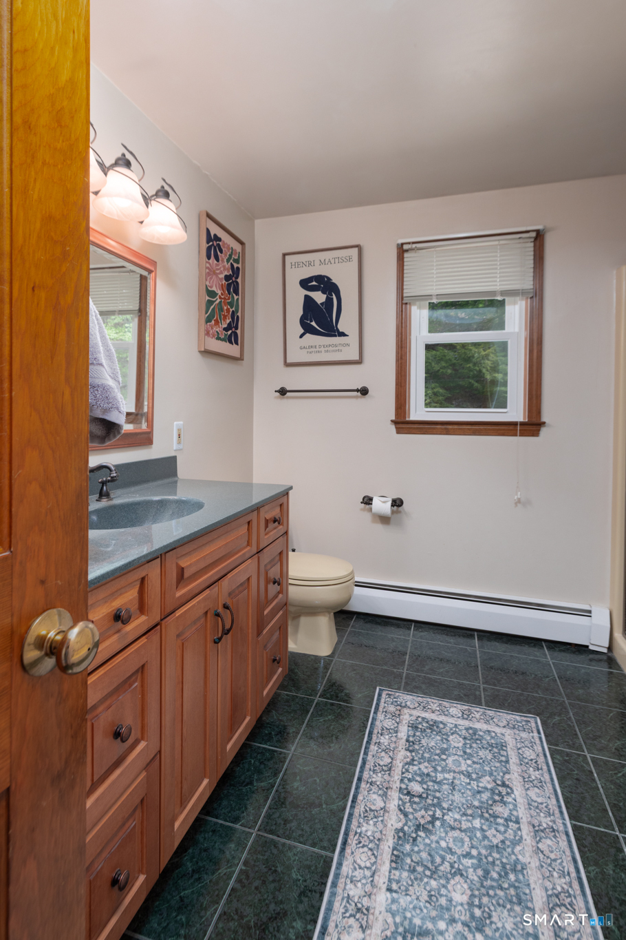 14 Crosswood Road Farmington, CT 06085 - Photo 30 of 39 a bathroom with a toilet sink and mirror