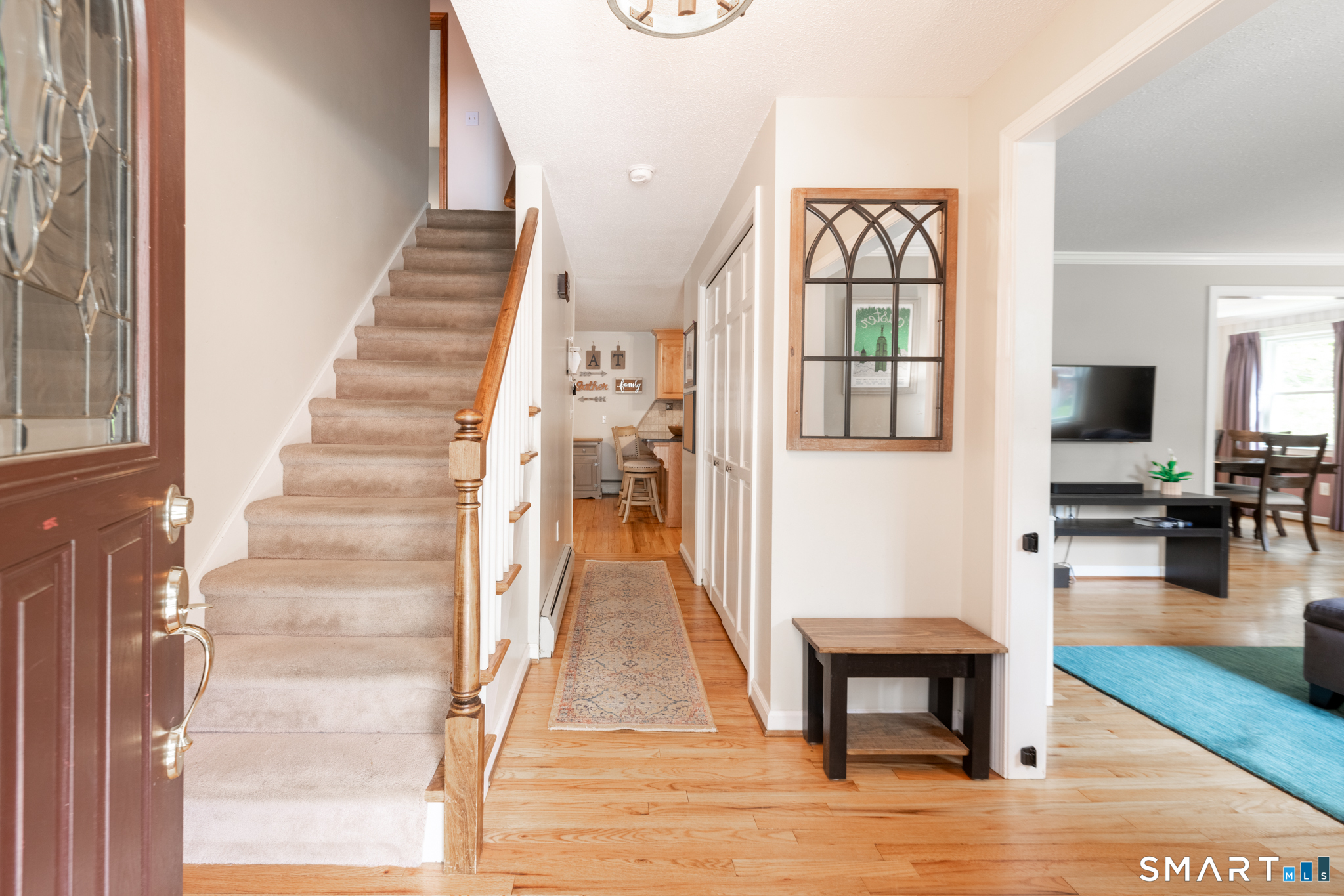 14 Crosswood Road Farmington, CT 06085 - Photo 6 of 39 a view of an entryway with wooden floor and a livingroom view