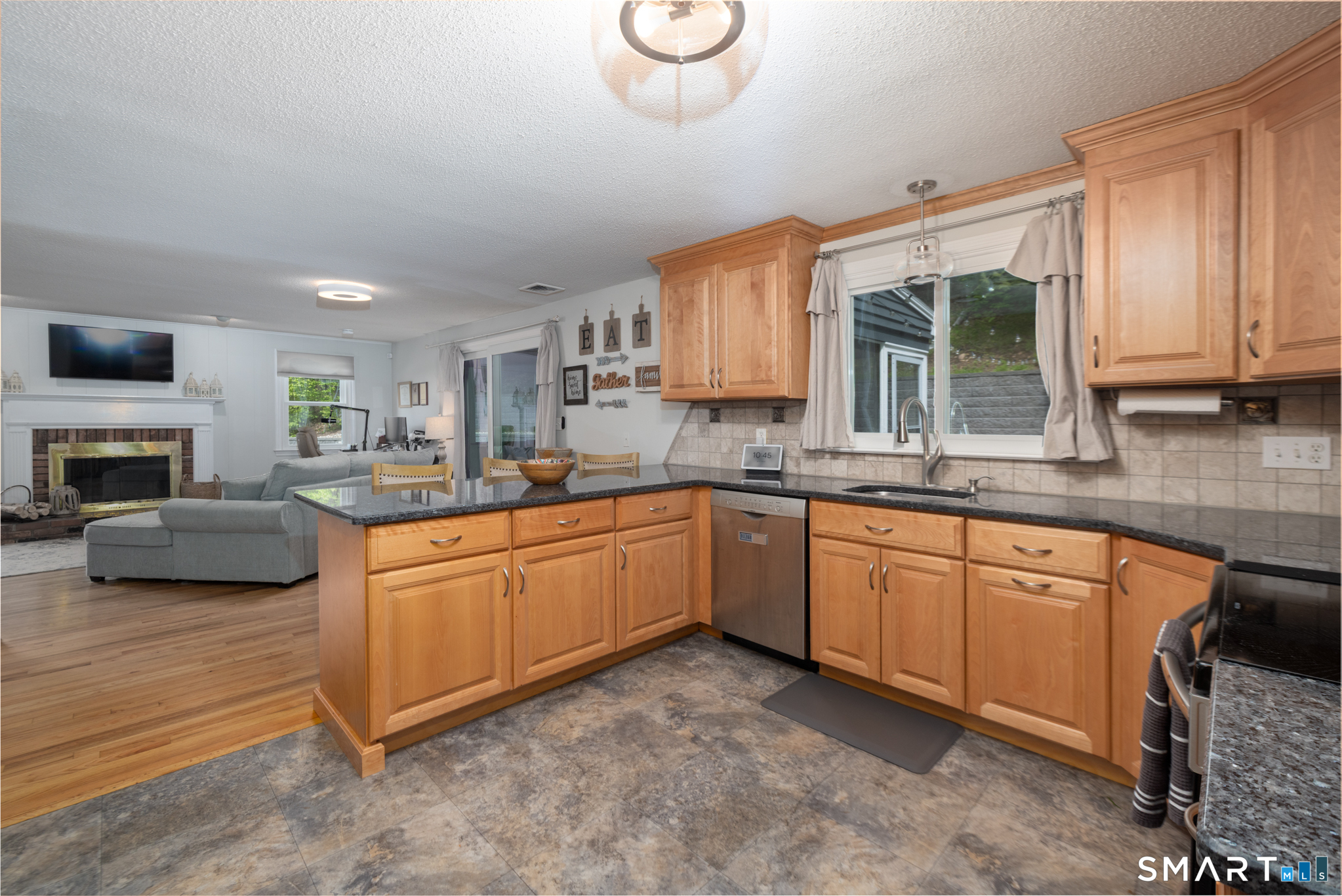 14 Crosswood Road Farmington, CT 06085 - Photo 7 of 39 a kitchen with granite countertop a sink cabinets and window