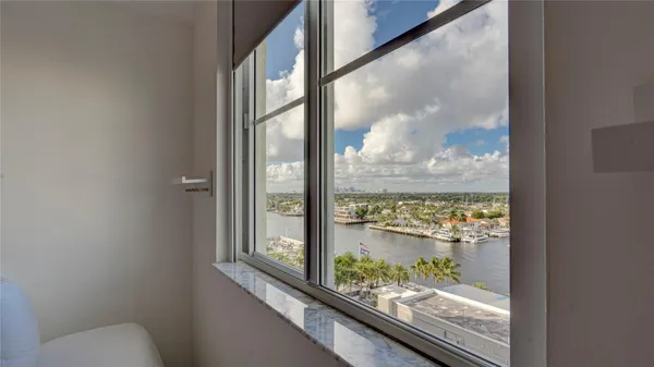 a view of a room that has a bed and a window