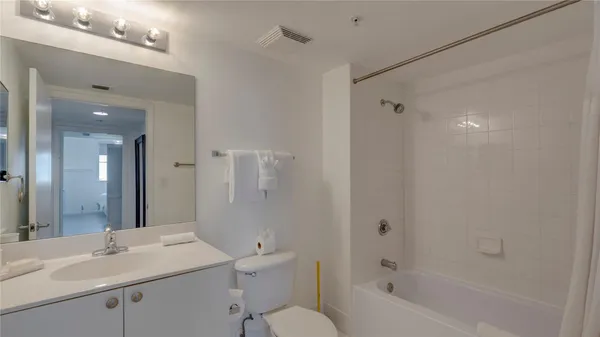 a bathroom with a sink toilet a tub and shower