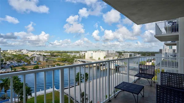 a view of a balcony with wooden floor