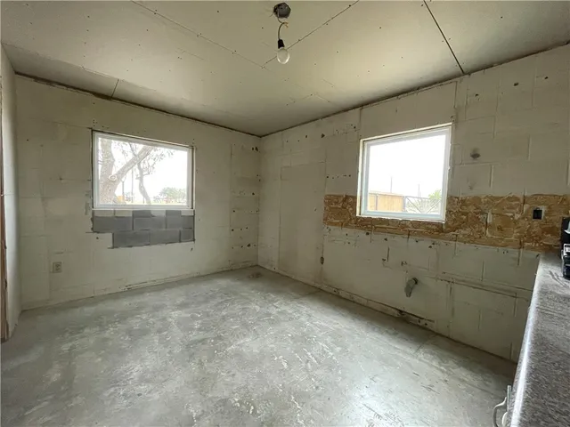 an empty room with windows