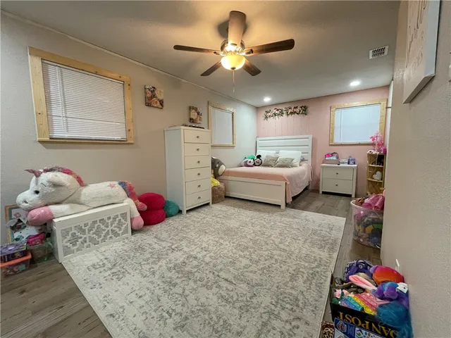 a living room with furniture and white walls