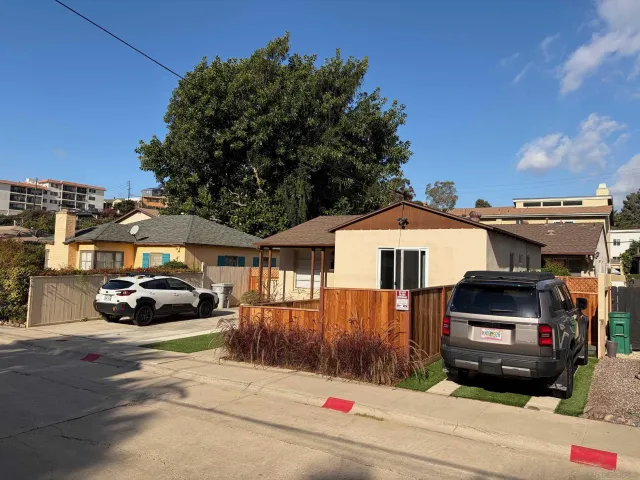 a car parked in front of a house