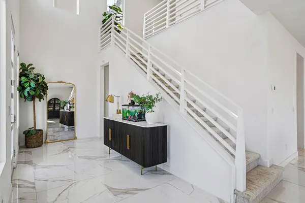 a kitchen with a table and chairs