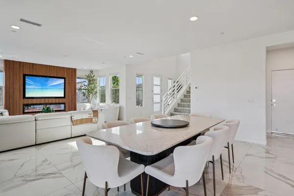 a bathroom with a granite countertop sink toilet a mirror and shower