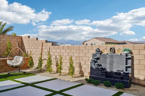 a reading room with furniture and a potted plant
