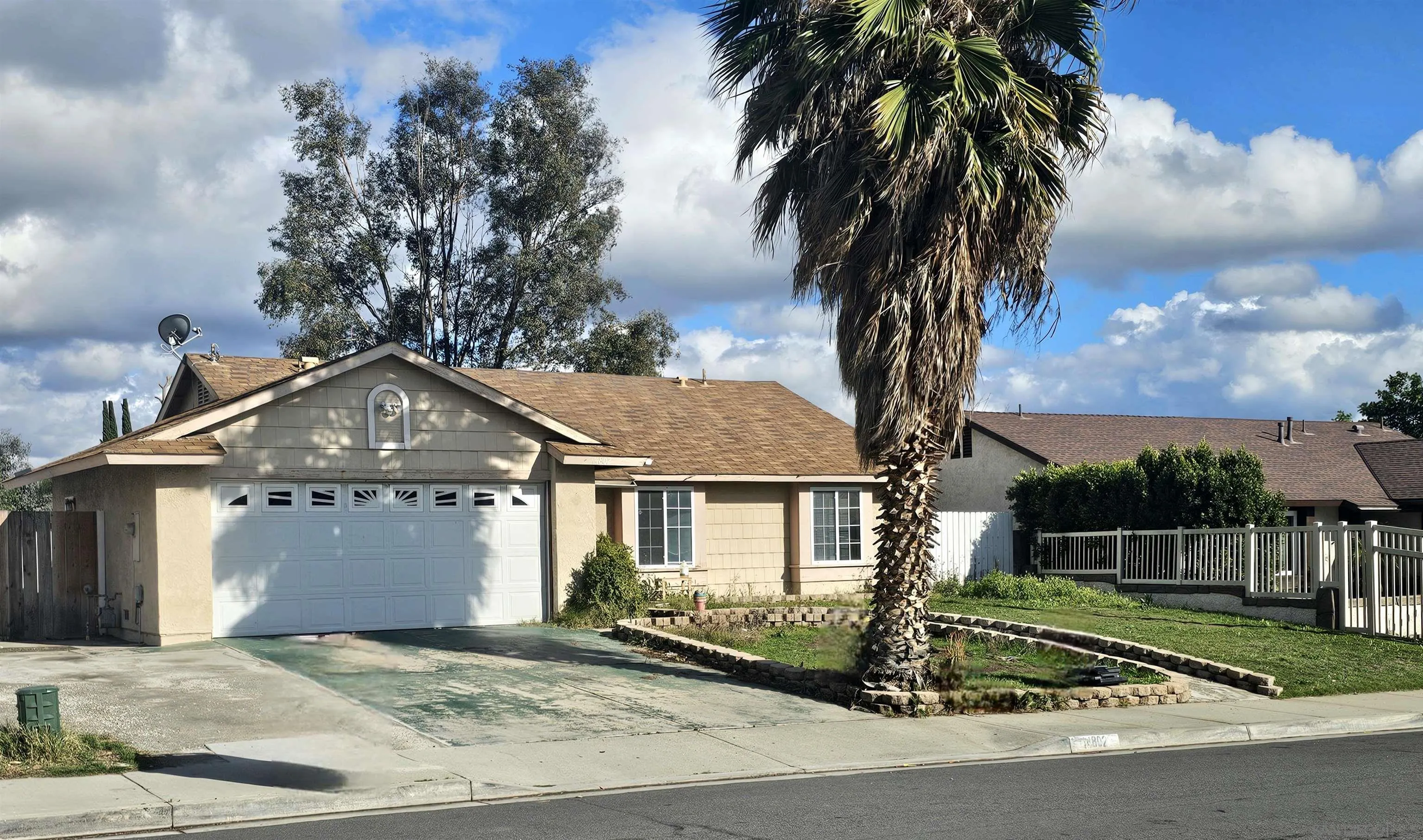 14802 Cloverfield Road Moreno Valley, CA 92553 - Photo 2 of 3 a front view of a house with a garden